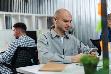 Fototapeta premium Group of young business people working in office together