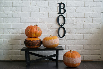 Interior decoration in autumn in the style of Halloween, with the inscription boo
