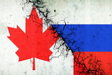 Cracked flags of Russia and Canada. International political relations. Conflict. Political Economic background.