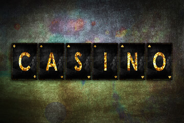 Casino, word, from alphabet on vintage playing cards, on a green grunge background. Casino. Gambling