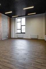 Empty open space office room with window