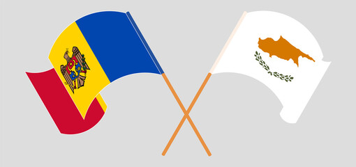 Crossed and waving flags of Moldova and Cyprus
