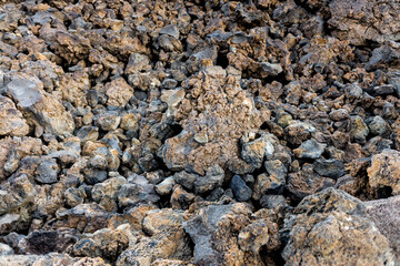 Rough, rugged solid lava rocks.