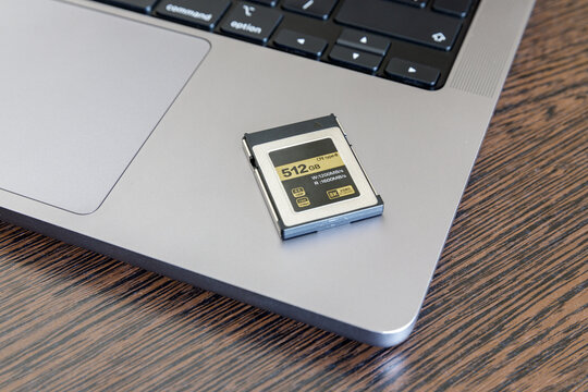 CFexpress memory card lies on a laptop