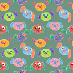 Seamless pattern of dog faces drawn with wax crayons on green background. For fabric, sketchbook, wallpaper, wrapping paper.