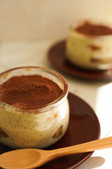 Italian dessert Tiramisu with chocolate powder 