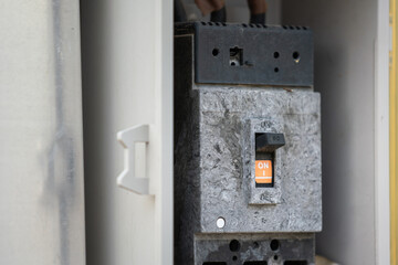 An electrical circuit breaker controller swtich on the junction box. Electrical equipment object...