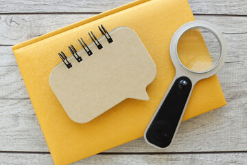 yellow notepad .top view image of an open notebook with empty pages with glasses on a wooden table. ready to add text or layout. Retro filter - obrazy, fototapety, plakaty