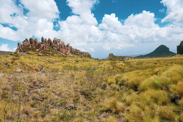Scenic view of rock formations against a mountain background at Ol Doinyo Lesatima Dragons Teeth in the Aberdares, Kenya