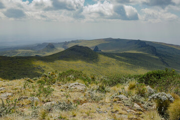 Scenic view of rock formations against a mountain background at Ol Doinyo Lesatima Dragons Teeth in the Aberdares, Kenya