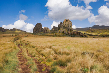 Scenic view of rock formations against a mountain background at Ol Doinyo Lesatima Dragons Teeth in the Aberdares, Kenya