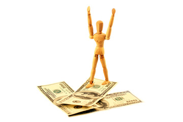 One hundred us dollars banknotes and wooden man