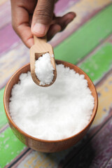 Coarse salt in a bowl on table 