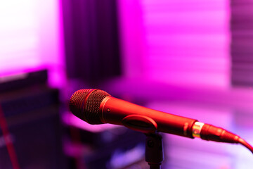 a microphone in a recording studio