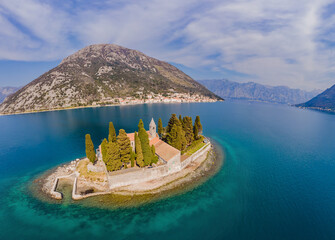 Aerophotography. View from flying drone. St George Island in the Bay of Kotor at Perast in...