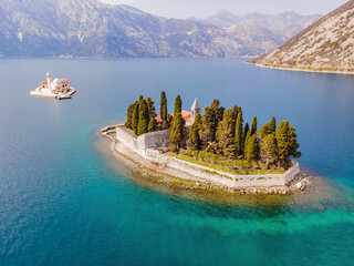 Aerophotography. View from flying drone. St George Island in the Bay of Kotor at Perast in...