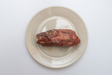 Roasted sweet potatoes on a plate that looks delicious