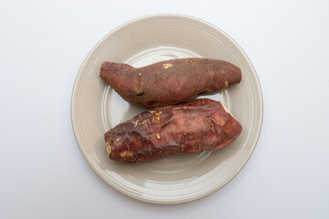 Roasted sweet potatoes on a plate that looks delicious