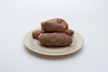 Roasted sweet potatoes on a plate that looks delicious