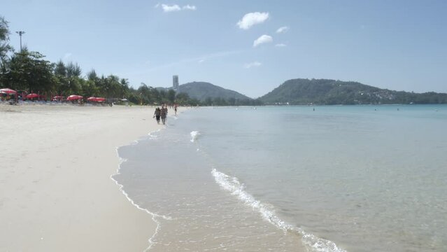 the beach with white sand and calm wave from peaceful sea in summer sunshine daytime.Summer vacation nature concerpt