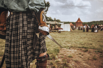 Shotlan warrior prepares for attack, close-up, saber focus