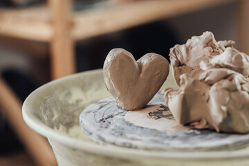 Close Up of Clay in a Shape of Heart on a Pottery Wheel