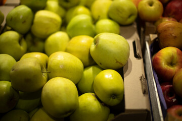 Apples in store. Lots of apples in drawer. Fresh fruit.