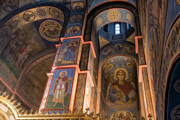 Fototapeta na wymiar Fragments of frescoes wall paintings on the walls of the St. Michael's Cathedral in Kyiv, Ukraine. June 2022