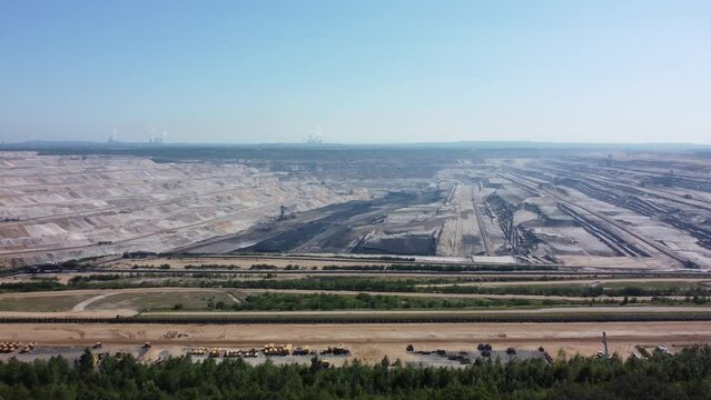 Hambach opencast lignite mine in the Rhenish lignite mining area near D&uuml;ren, Aerial flying from the forest
