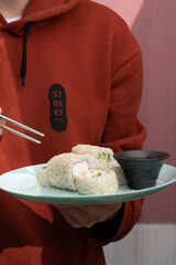 person holding bowl of rice