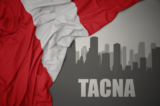 abstract silhouette of the city with text Tacna near waving colorful national flag of peru on a gray background.