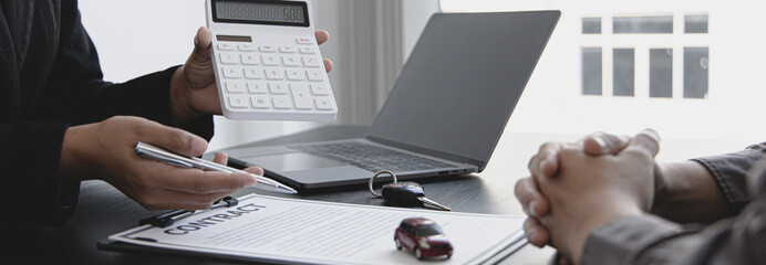 Car salesman offers prices and conditions for buying or renting a car to a customer, Entering into a car purchase-sale agreement with insurance, Way of business people conversation.