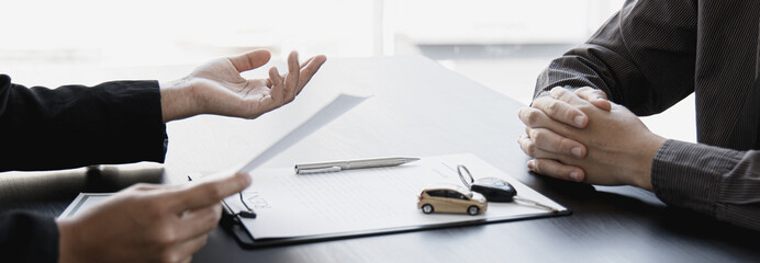 Car salesman offers prices and conditions for buying or renting a car to a customer, Entering into a car purchase-sale agreement with insurance, Way of business people conversation.