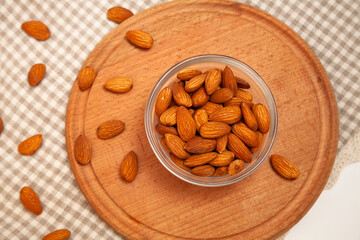 Close-up of natural big raw peeled almonds nuts as a background