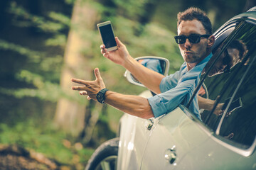 Angry Car Driver with Phone in Hand