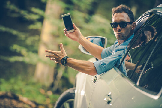 Angry Car Driver With Phone In Hand