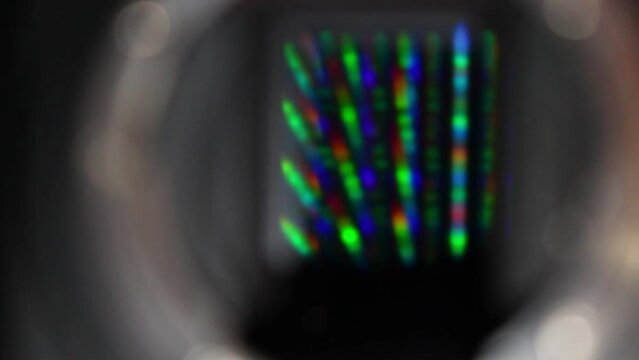 Colourful full frame sensor of a black DSLR Camera. Static close-up shot with manual rack focussing