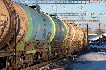 Passing freight train from tanks for the transportation of petroleum products close-up 