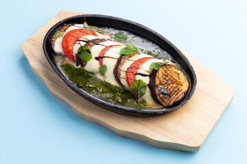 Baked eggplant, tomatoes and mozzarella cheese.