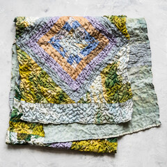 folded patchwork scarf sewn from silk fabrics