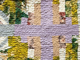 Fototapeta na wymiar handcrafted pattern of crinkled patchwork scarf