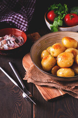 Fresh Cooked, new potatoes,with dill, on a wooden table, selective focus. close-up, toning, no people,