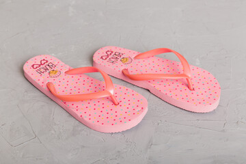 Beach accessories. Flip flops and starfish on colored background. Top view Mock up with copy space