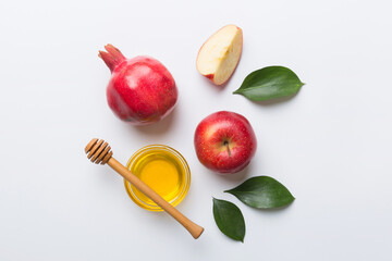 Flat lay composition with symbols jewish Rosh Hashanah holiday attributes on colored background,...