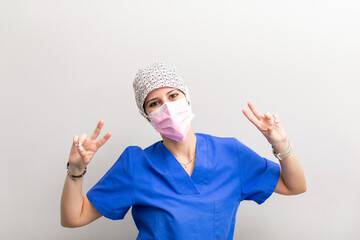 Dentist woman posing for the camera at the dental clinic hall