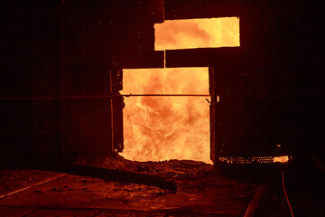 Tap hole of blast furnace at steel mill.
