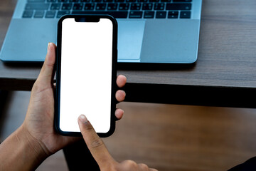 Man holding a smartphone with a simulated white screen