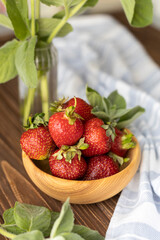Strawberries in wood plate. Summer life. 