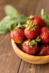 Strawberries in wood plate. Summer life. 