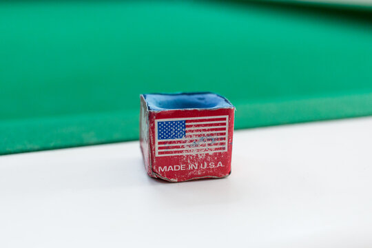 Billiard chalk. Close-up image of billiard chalk. White billiard table close-up.